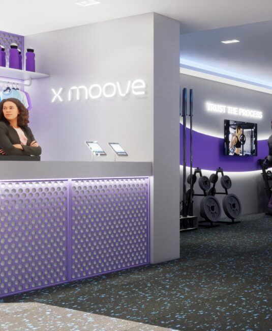 Balcão de recepção com o logotipo xMoove iluminado, projeto conceito de franquia da Unpack Design